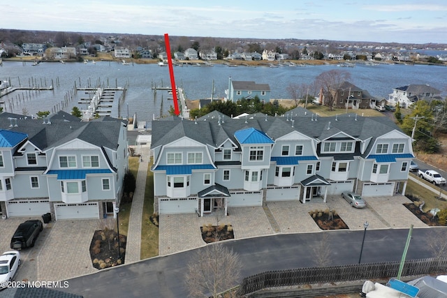 aerial view featuring a water view and a residential view