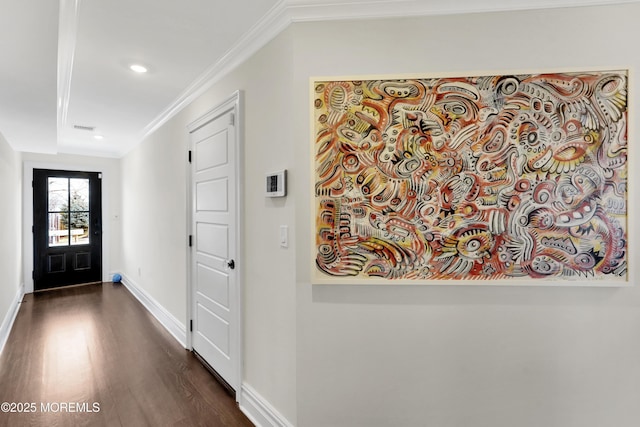 entrance foyer featuring recessed lighting, dark wood-type flooring, crown molding, and baseboards