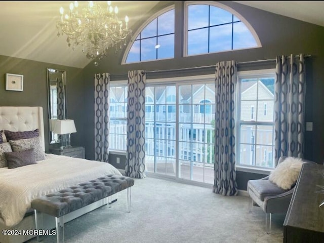 carpeted bedroom with access to exterior, lofted ceiling, and a chandelier