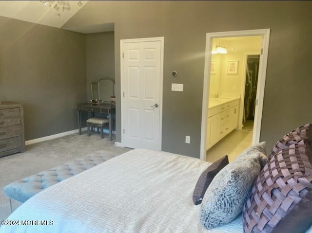 bedroom featuring light colored carpet and baseboards