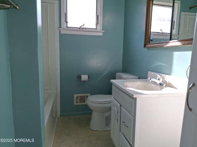 bathroom featuring vanity, washtub / shower combination, visible vents, tile patterned flooring, and toilet