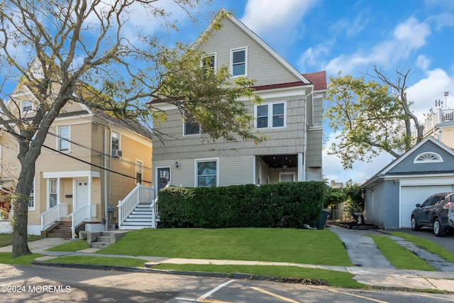 view of front facade featuring a garage, driveway, and a front yard