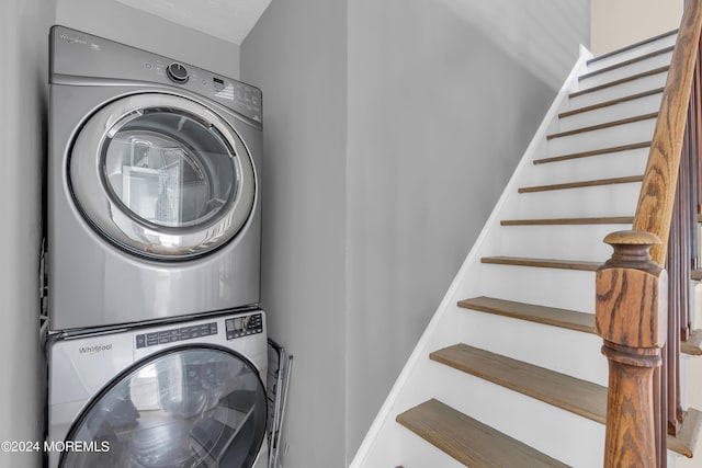 laundry room featuring laundry area and stacked washing maching and dryer