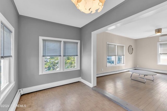 unfurnished room featuring parquet flooring, baseboards, and a baseboard radiator