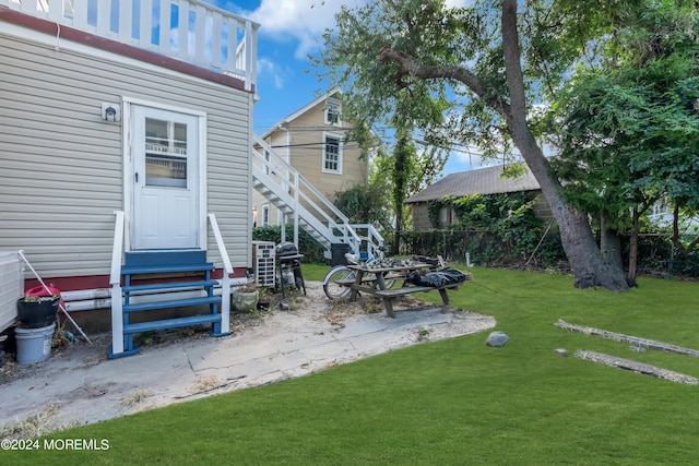 view of yard featuring entry steps