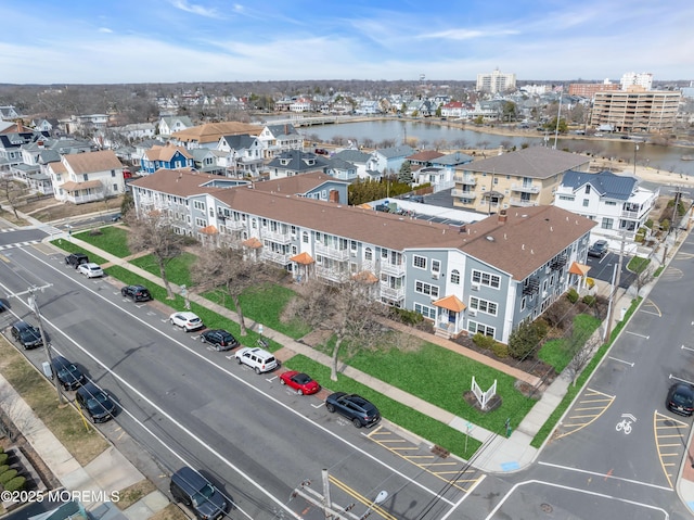 drone / aerial view with a water view