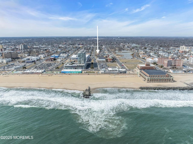 bird's eye view with a view of the beach, a view of city, and a water view