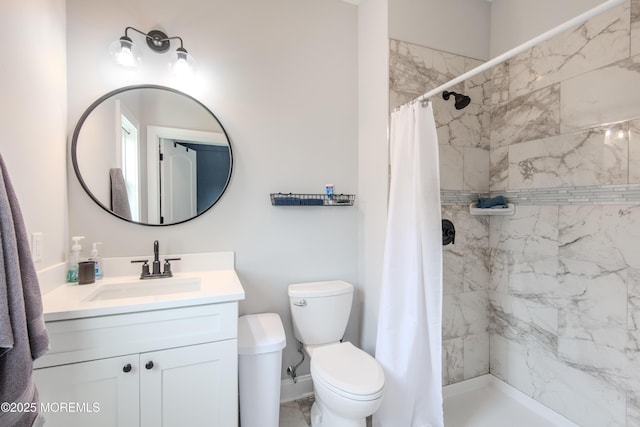 full bathroom featuring vanity, a shower stall, toilet, and marble finish floor