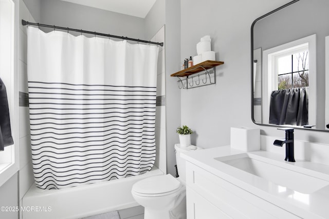 bathroom with toilet, shower / bath combo with shower curtain, and vanity