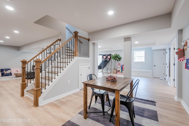 dining space with stairway, recessed lighting, light wood-style floors, and baseboards