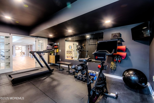 workout area featuring recessed lighting, french doors, and baseboards