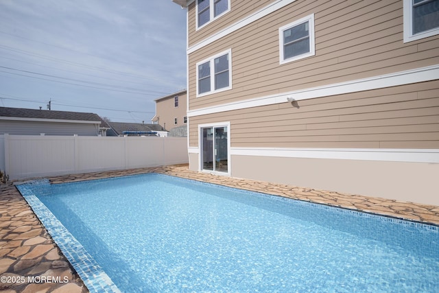 view of swimming pool with fence and a fenced in pool