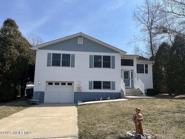 view of front of house featuring concrete driveway, an attached garage, and a front lawn