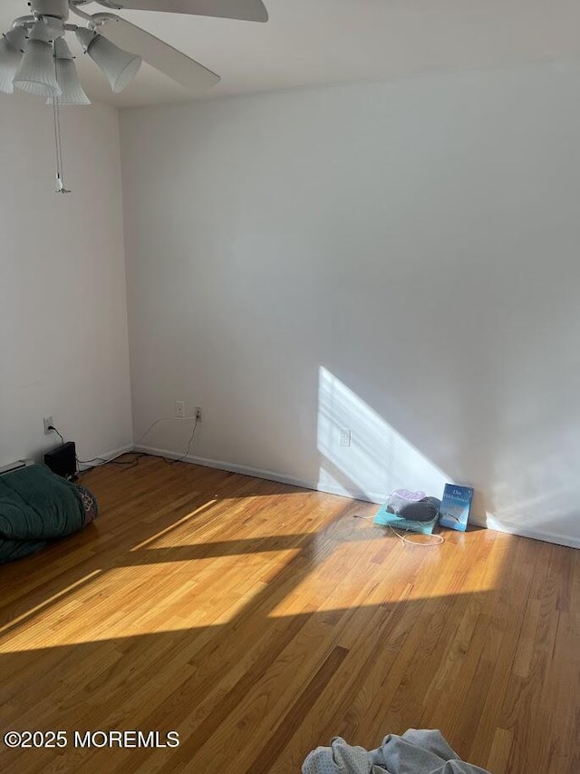 unfurnished bedroom featuring ceiling fan and wood finished floors