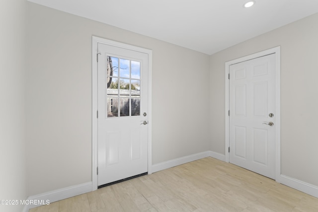 entryway featuring recessed lighting, light wood-style floors, and baseboards