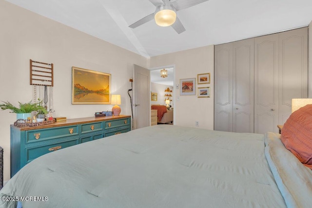 bedroom with a closet, a ceiling fan, and lofted ceiling