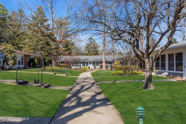 view of property's community featuring a yard