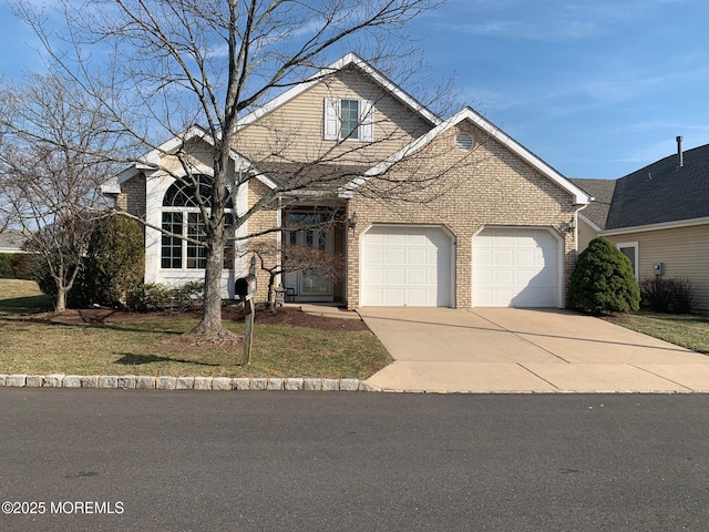 view of front of house with a front yard, an attached garage, brick siding, and driveway