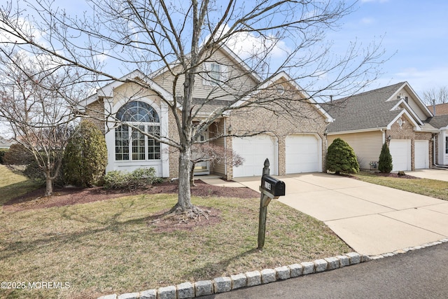 view of front of home with brick siding, driveway, a front lawn, and a garage