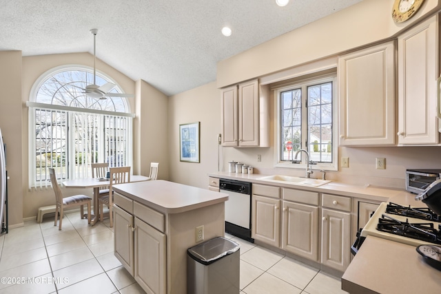 kitchen with a kitchen island, light countertops, lofted ceiling, white appliances, and a sink