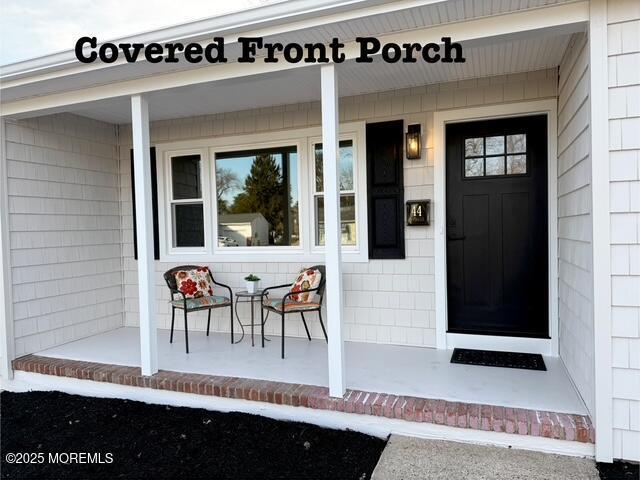 entrance to property with covered porch