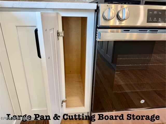 interior details with stainless steel electric range and oven