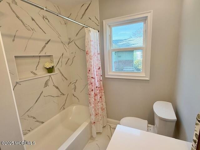 bathroom with baseboards, toilet, marble finish floor, and shower / tub combo