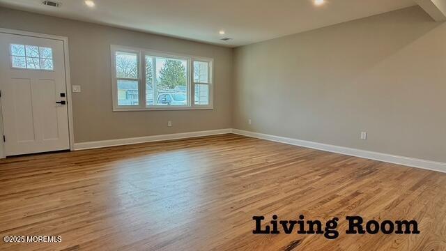 entrance foyer featuring recessed lighting, visible vents, baseboards, and wood finished floors