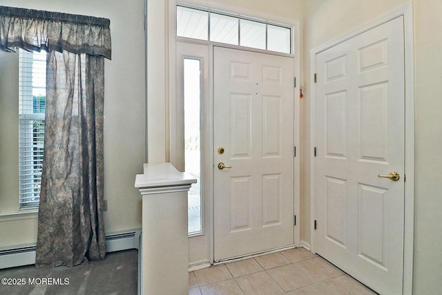foyer entrance featuring light tile patterned floors