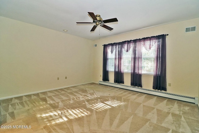 empty room with visible vents, carpet, baseboards, baseboard heating, and ceiling fan