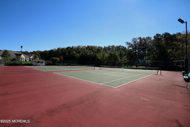 view of sport court with community basketball court and fence