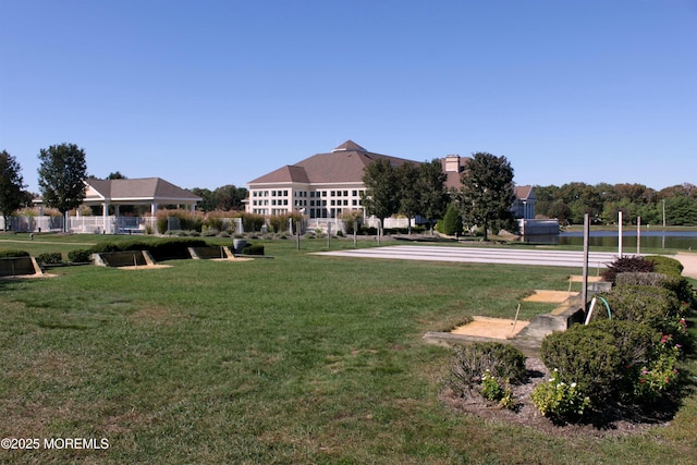 view of home's community with a yard