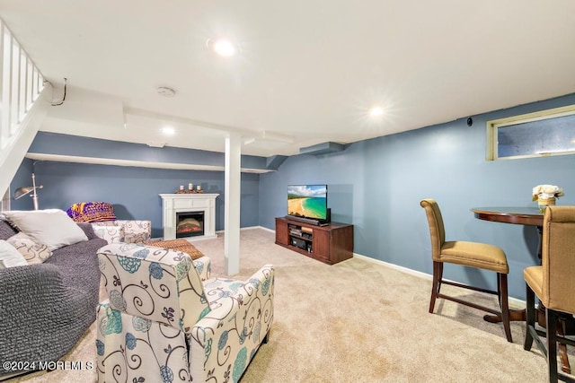 carpeted living room featuring recessed lighting, baseboards, and a warm lit fireplace