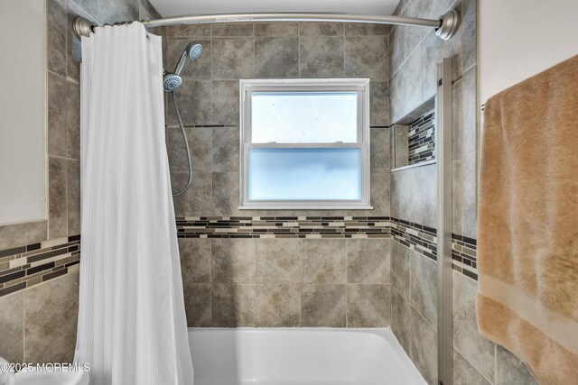 full bathroom with shower / bathtub combination with curtain