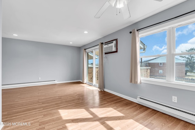 unfurnished room featuring light wood finished floors, a baseboard heating unit, baseboards, and a baseboard radiator