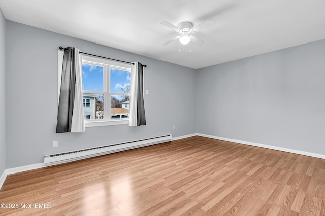 unfurnished room with light wood finished floors, baseboards, baseboard heating, and ceiling fan