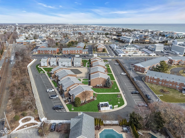 birds eye view of property featuring a residential view and a water view