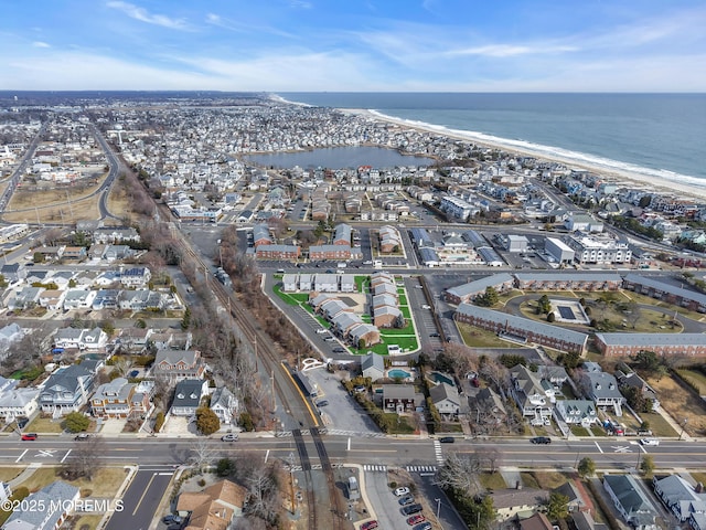 birds eye view of property featuring a residential view and a water view