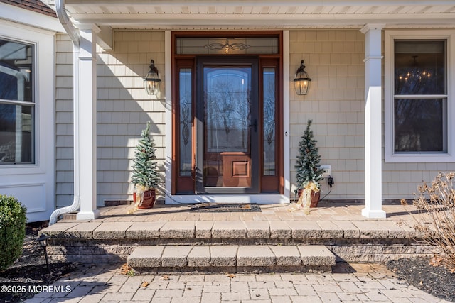 entrance to property featuring a porch