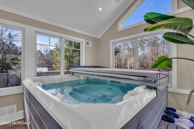 view of pool with an indoor hot tub