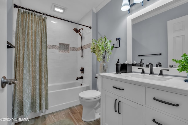 bathroom with vanity, toilet, shower / tub combo with curtain, and wood finished floors