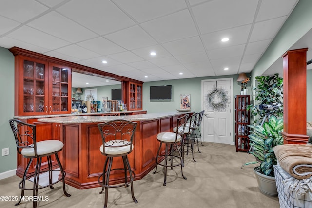 bar with light carpet, recessed lighting, and bar