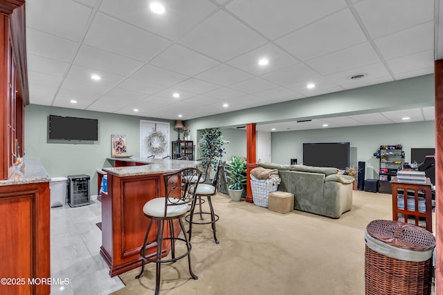 bar featuring visible vents, bar area, beverage cooler, recessed lighting, and a paneled ceiling