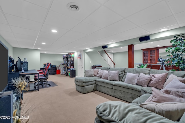 carpeted living area featuring a drop ceiling, visible vents, recessed lighting, and stairway