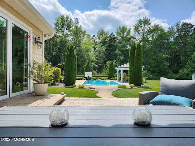 exterior space with a gazebo, a patio area, and a lawn