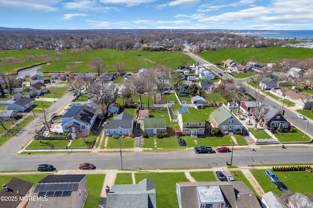 birds eye view of property with a residential view