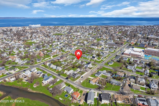 bird's eye view with a water view and a residential view