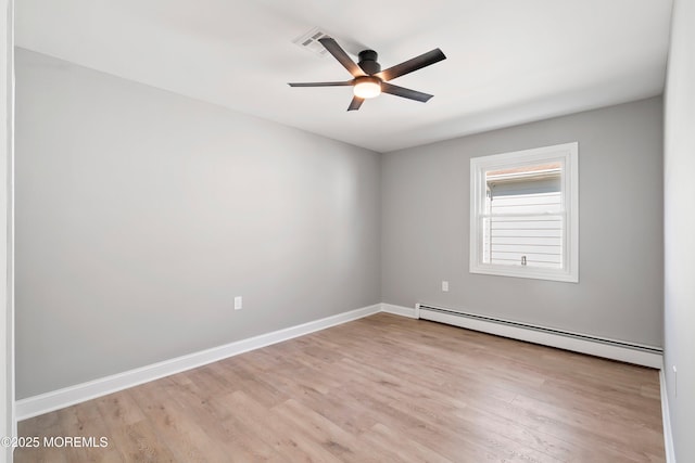 unfurnished room with baseboard heating, baseboards, ceiling fan, and wood finished floors