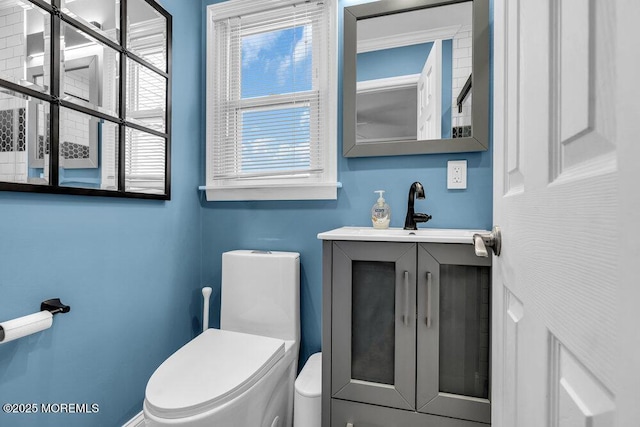 bathroom with toilet and vanity