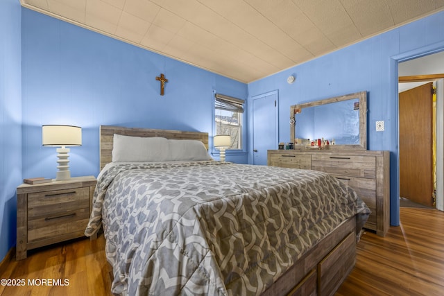 bedroom featuring wood finished floors